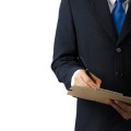 Businessman signing a document