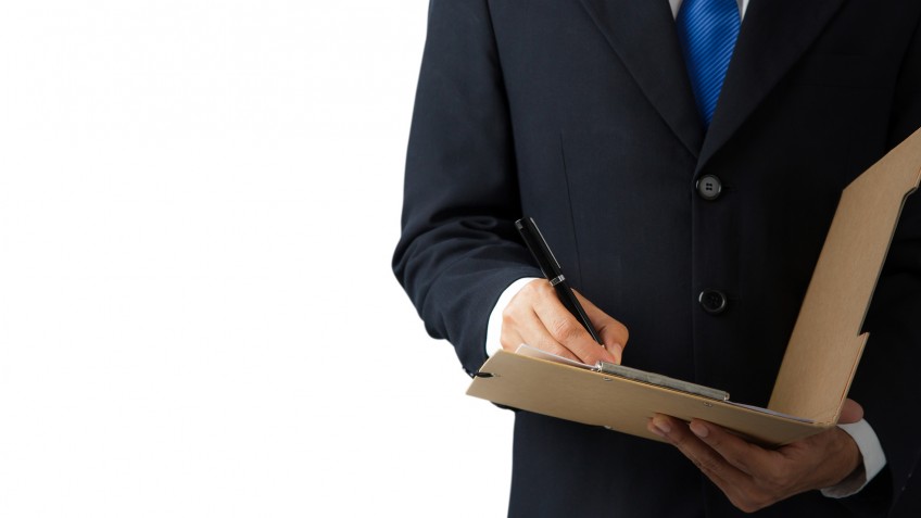 Businessman signing a document