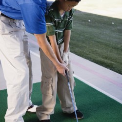 Father and Son Practicing Golf