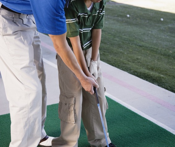 Father and Son Practicing Golf