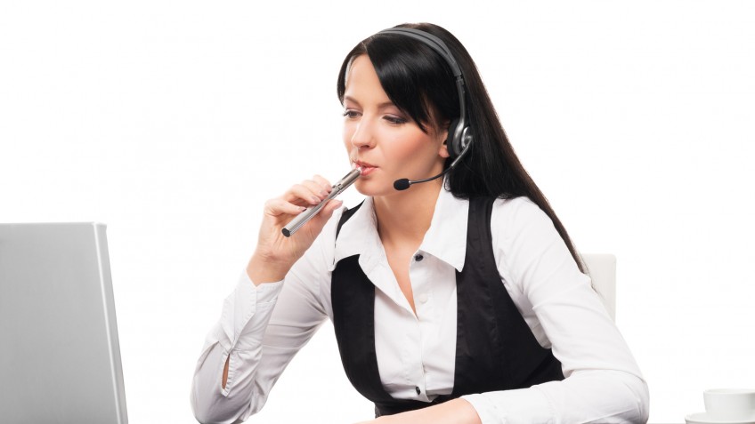 Young and attractive businesswoman with an electronic cigarette