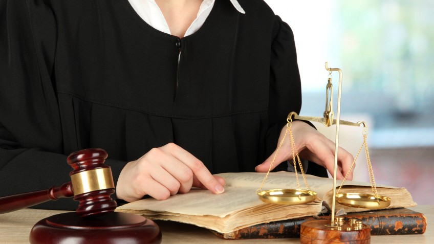 Judge sitting at table during court hearings on room background