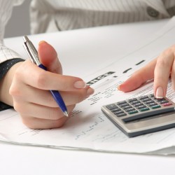 Business woman working with tax documents.