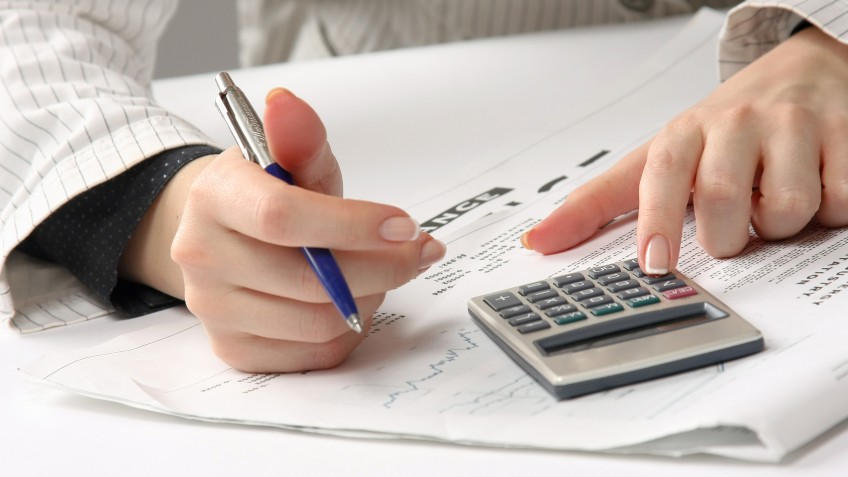 Business woman working with tax documents.