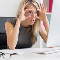 Tired and exhausted woman at work