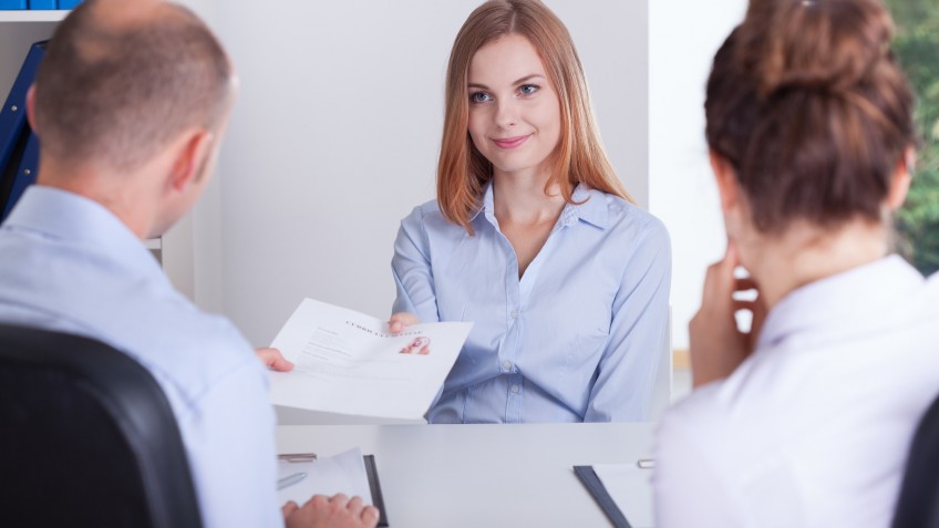 Young pretty woman and the begining of her job interview