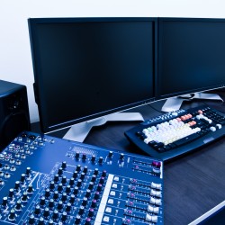 editing station with audio mixer and dual monitor