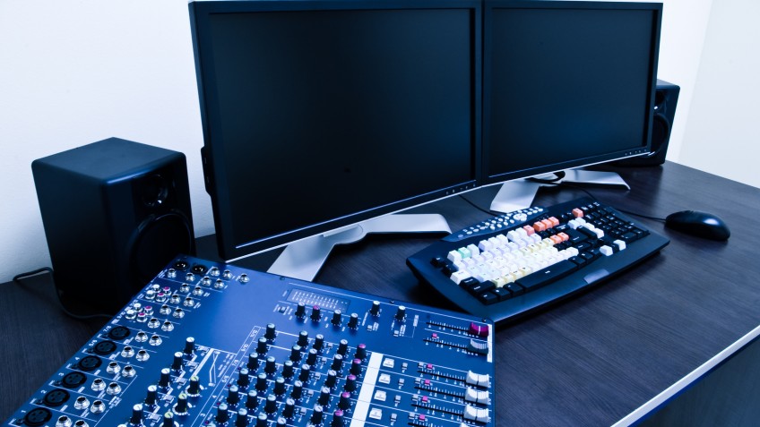 editing station with audio mixer and dual monitor