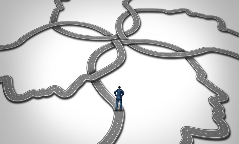 Social management and career manager business concept as a person standing on a group of connected roads that are shaped as a human face as a symbol of public relations and managing people.