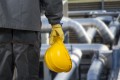 worker with helmet in front of production hall