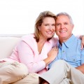 Senior couple at new home. Retirement security concept.