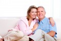 Senior couple at new home. Retirement security concept.