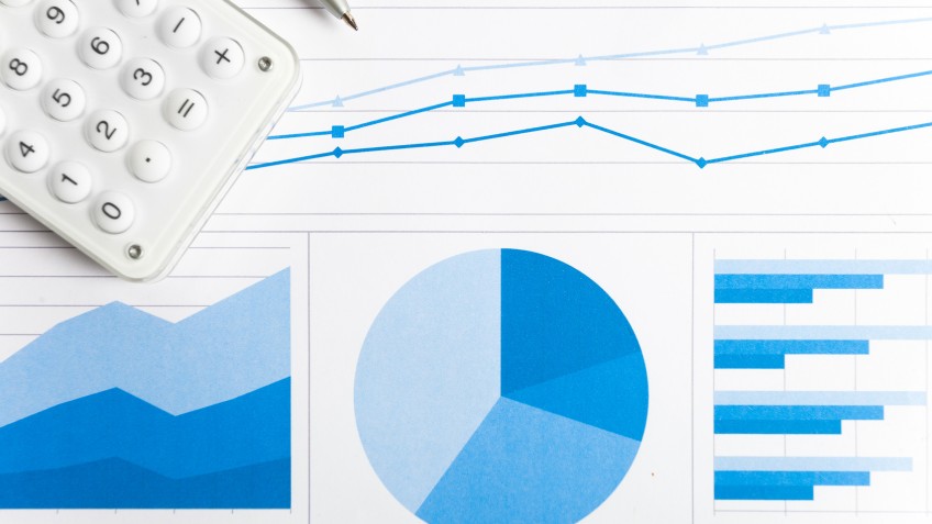 Accounting concept: pen, calculator and paperwork