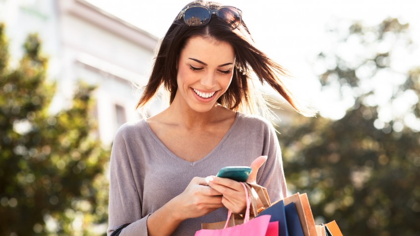 Beautiful young woman using a mobile phone