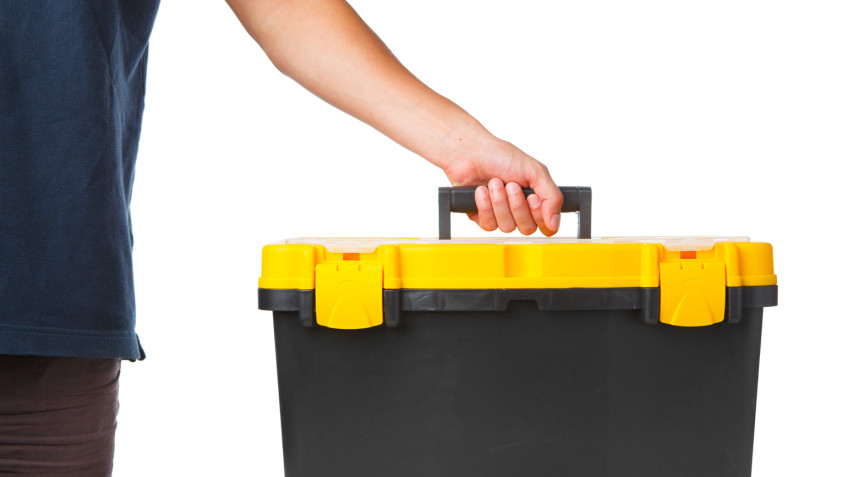 tool box in hand isolated on white