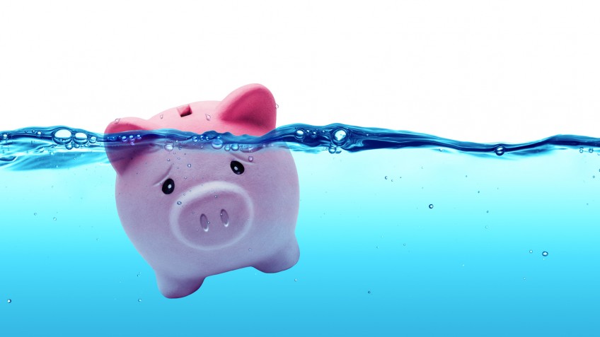 Piggy bank drowning in debt - savings to risk