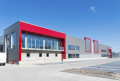 newly build modern red office building with warehouse