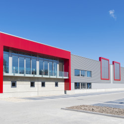 newly build modern red office building with warehouse