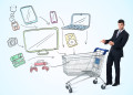 Businessman pushing a shopping cart drawn media devices coming out of it