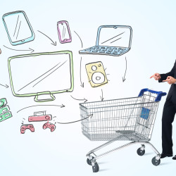 Businessman pushing a shopping cart drawn media devices coming out of it