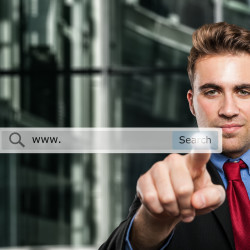 Business man clicking a search button