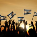 Silhouettes of People Waving the Flag of Israel