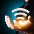 Wifi technology symbol in businessman hand