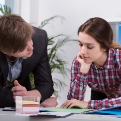 Manager and employee thinking together on new ideas