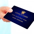 hand holding loyalty card isolated over white background