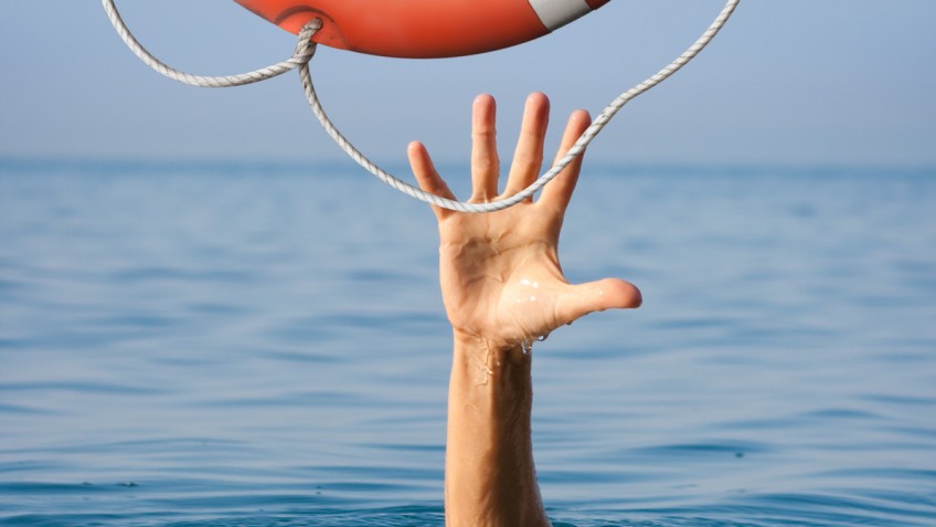 Lifebuoy for drowning man in sea or ocean water